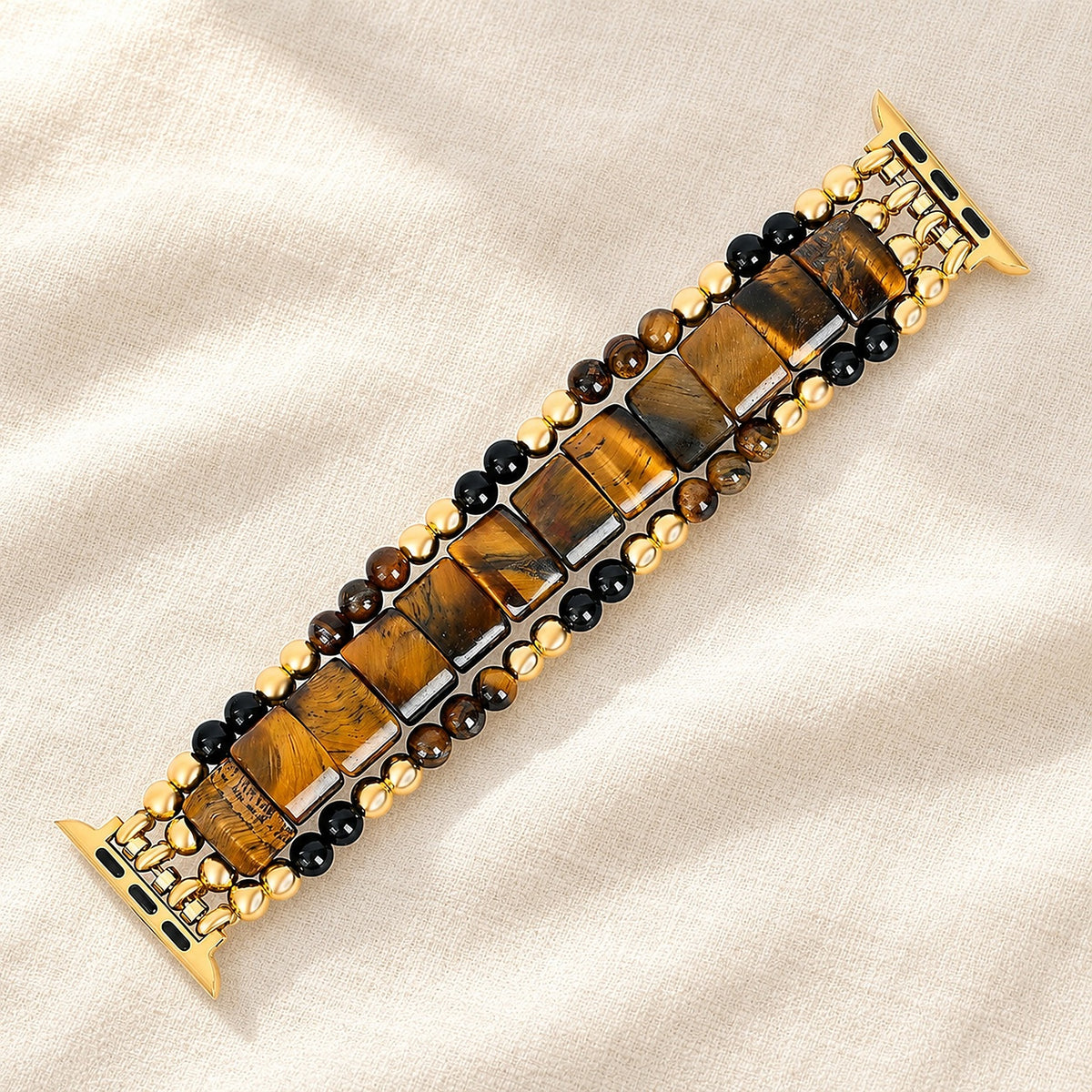 Fearless Heart tiger's eye Apple Watch strap laid flat on linen