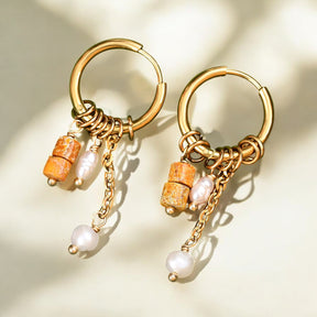 Boucles d'oreilles en forme de goutte avec un anneau en rouille dorée